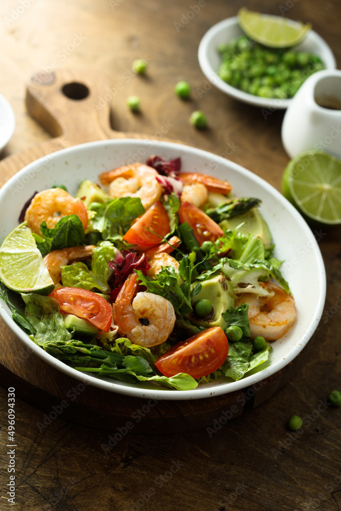 Healthy green salad with shrimps and avocado