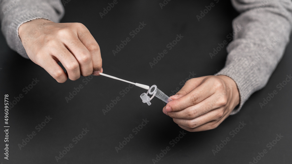 Close up of a person using coronavirus covid-19 rapid antigen home test
