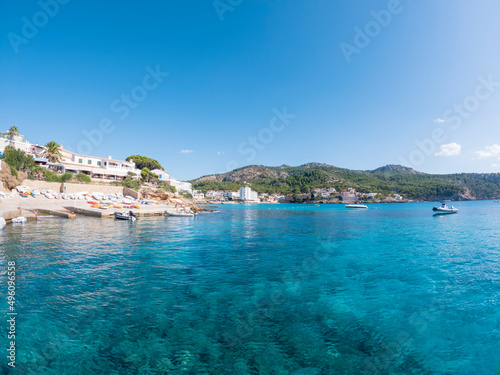 Water foreground with turquoise clear water of the Mediterranean Sea on the tourist resort of Sant Elm, Mallorca, Spain