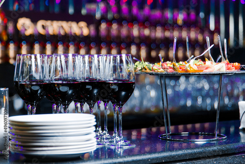 Decorated catering banquet table with different food appetizers assortment on a party photo