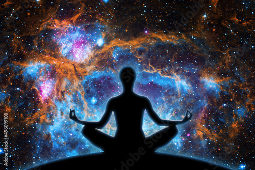 Yoga figure against universe background with Nebula.- Elements of this image furnished by NASA