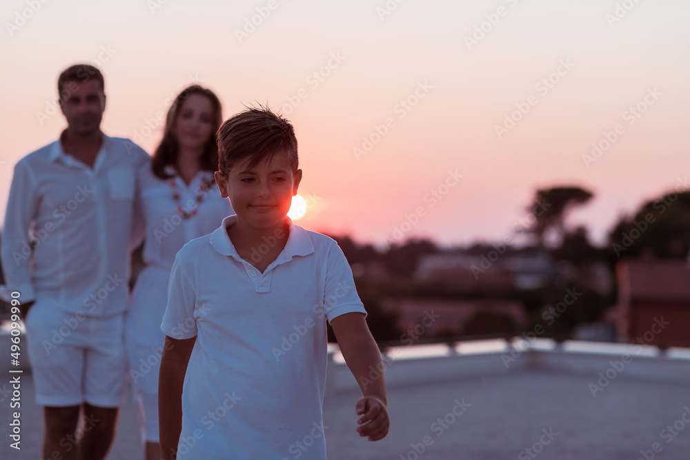 Fototapeta premium Happy family enjoys and spends time together on the roof of the house. Selective focus 