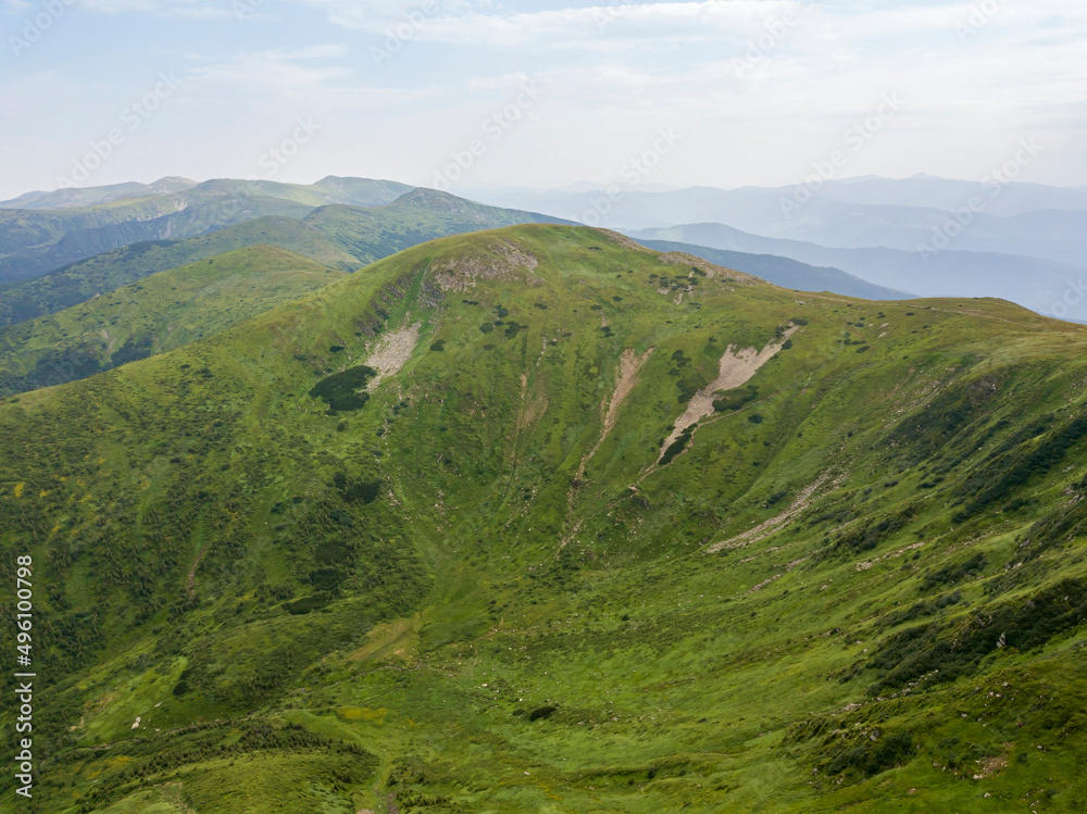 Obraz premium High mountains of the Ukrainian Carpathians in cloudy weather. Aerial drone view.