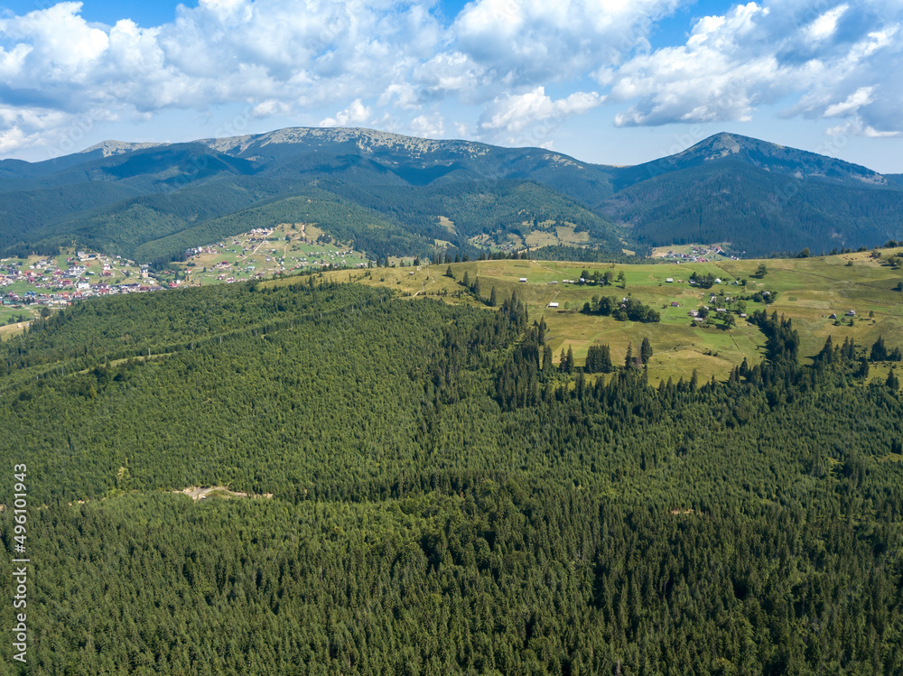 Fototapeta premium Green mountains of Ukrainian Carpathians in summer. Sunny day. Aerial drone view.