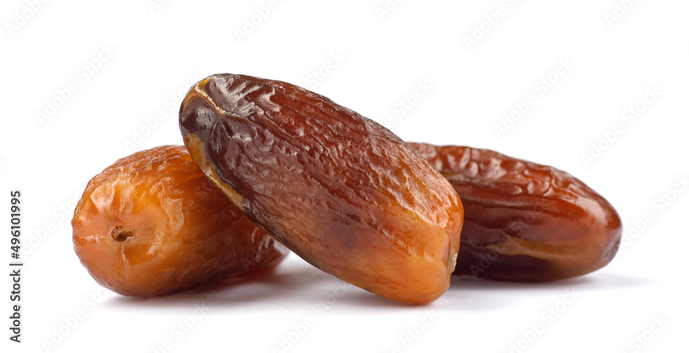 Three delicious dried dates are isolated on a white background. Full clipping path.