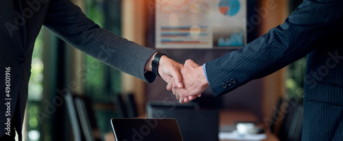 Photos Cropped shot of businessman handshake for teamwork of business merger and acquisition