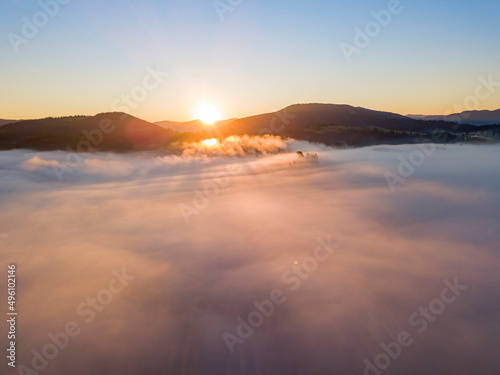 Sunrise over the fog in the Ukrainian Carpathians. Aerial drone view. © Sergey