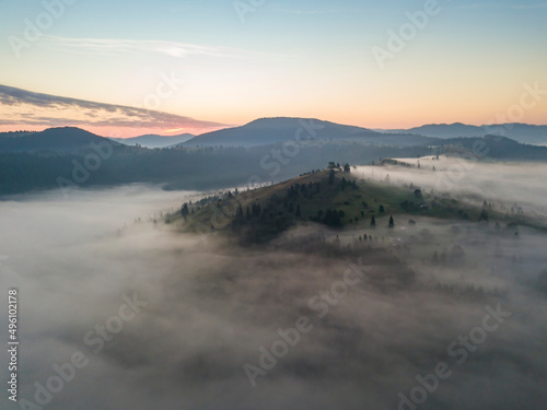 Morning fog in the Ukrainian Carpathians. Aerial drone view.