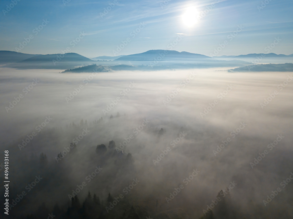 Obraz premium Morning mist in Ukrainian Carpathian mountains. Aerial drone view.