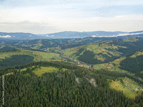 Fototapeta Naklejka Na Ścianę i Meble -  Green mountains of Ukrainian Carpathians in summer. Aerial drone view.