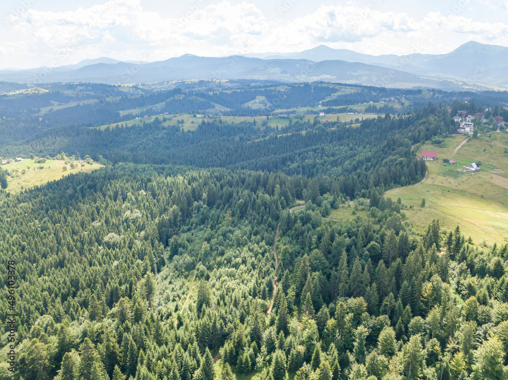 Green mountains of Ukrainian Carpathians in summer. Sunny day. Aerial drone view.