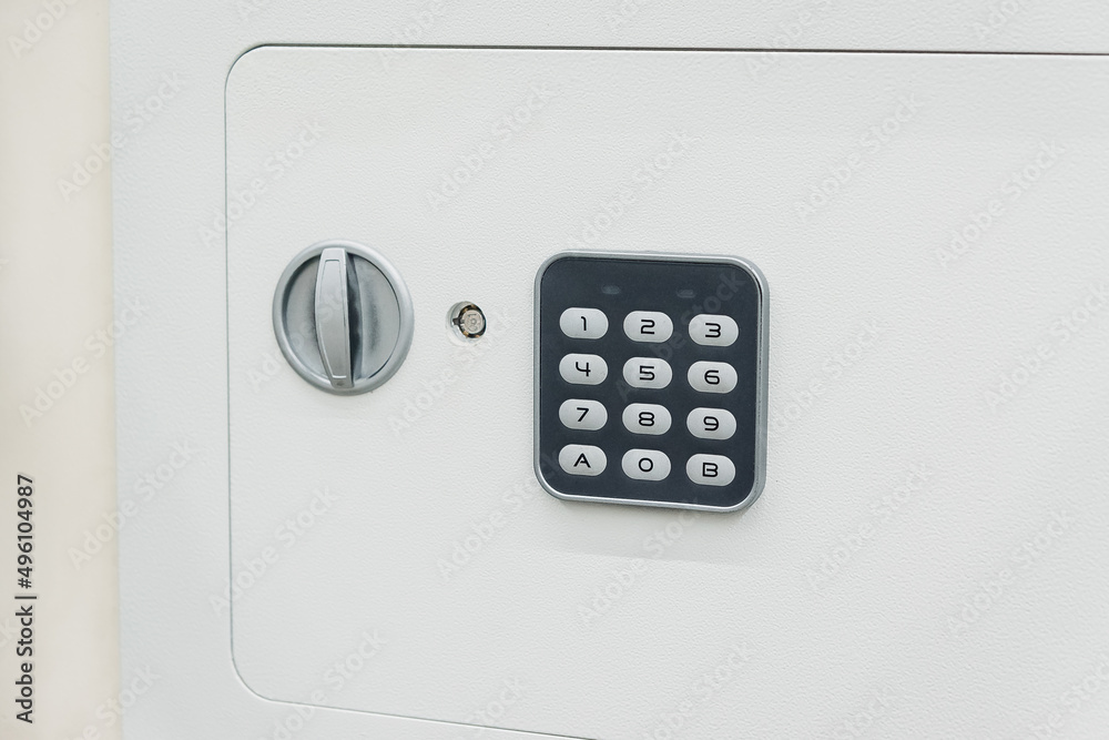 A white safe with a combination lock. Deposit module for storing money at home and in the office A white safe with a combination lock. Deposit module for storing money at home and in the office