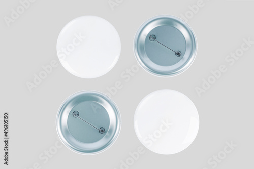 Round badges. White plastic badge mockup, isolated buttons witn pins. Realistic round magnet with metallic blank back side. 3d rendering. photo