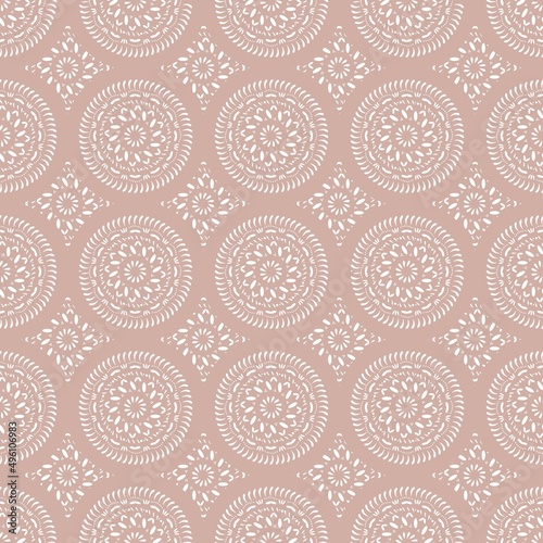 Oriental ornamental seamless mandala pattern with lacy ornaments on pastel pinkish background. Print for fabric wallpaper