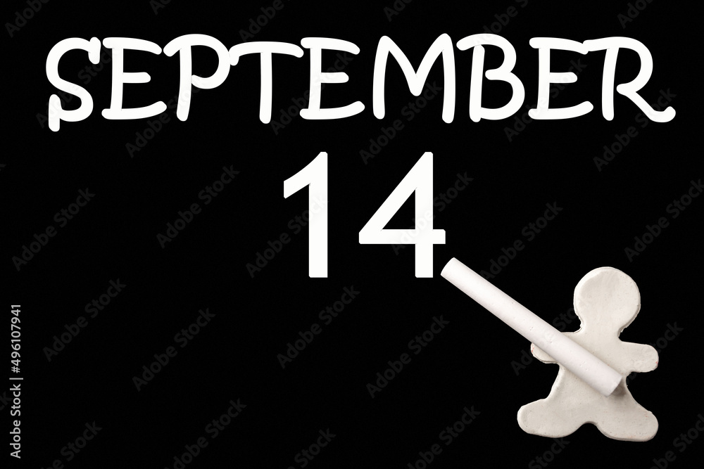 A small white plasticine man writing the date 14 September on a black board. Business concept. Education concept. A small white plasticine man writing the date 14 September on a black board. Business concept. Education concept.