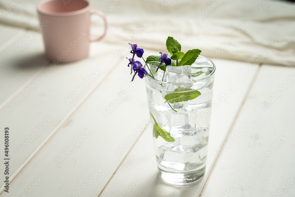 Fresh glass of soda water garnish herb