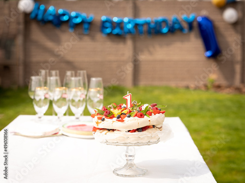 Fototapeta Naklejka Na Ścianę i Meble -  Sweet fresh fruit birthday cake pavlova 1 year anniversary party