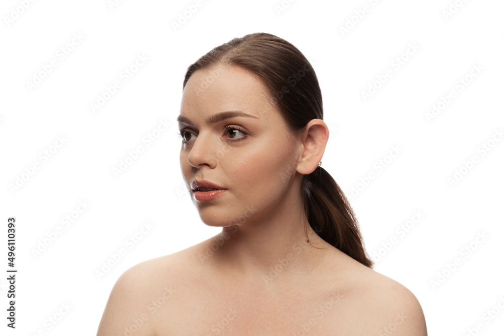 Portrait of beautiful woman with no makeup face with ponytail looking left side, posing isolated over white studio background. Portrait of beautiful woman with no makeup face with ponytail looking left side, posing isolated over white studio background.