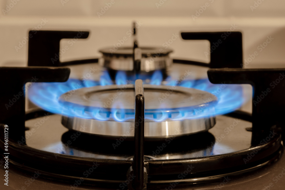 Flame On Stove burner, close-Up Of Gas Stove Burners. Selective focus burner. Selectice Focus Front view. Flame On Stove burner, close-Up Of Gas Stove Burners. Selective focus burner. Selectice Focus Front view.