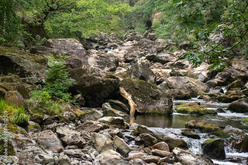 Fast flowing water/waterfalls flowing through the Aberglaslyn Pass near to Beddgelert, in Snowdonia National Park, north Wales photo