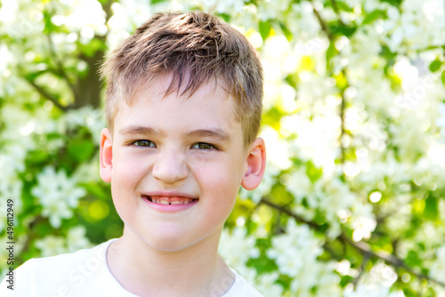 cheerful boy in nature, close-up