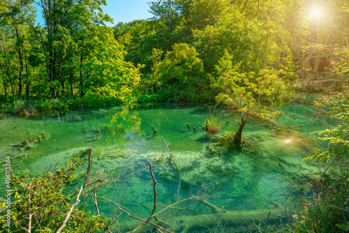 sunshine by the Milino Jezero lake of Plitvice Lakes National Park in Lika region of Croatia. UNESCO World Heritage of Croatia named Plitvicka Jezera.