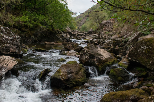 Fast flowing water/waterfalls flowing through the Aberglaslyn Pass near to Beddgelert, in Snowdonia National Park, north Wales photo
