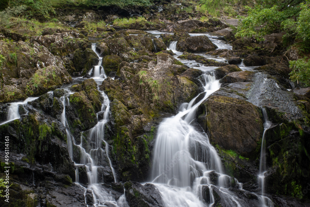 Rhaeadr Ewynnol (Swallow Falls) waterfall, close to the town of Betws-y-Coed. In Snowdonia National Park, north Wales Rhaeadr Ewynnol (Swallow Falls) waterfall, close to the town of Betws-y-Coed. In Snowdonia National Park, north Wales