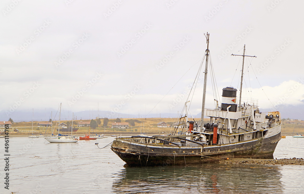 The Historic St. Christopher Shipwreck at the dock area of Ushuaia's Coast, Province of Tierra del Fuego, Argentina