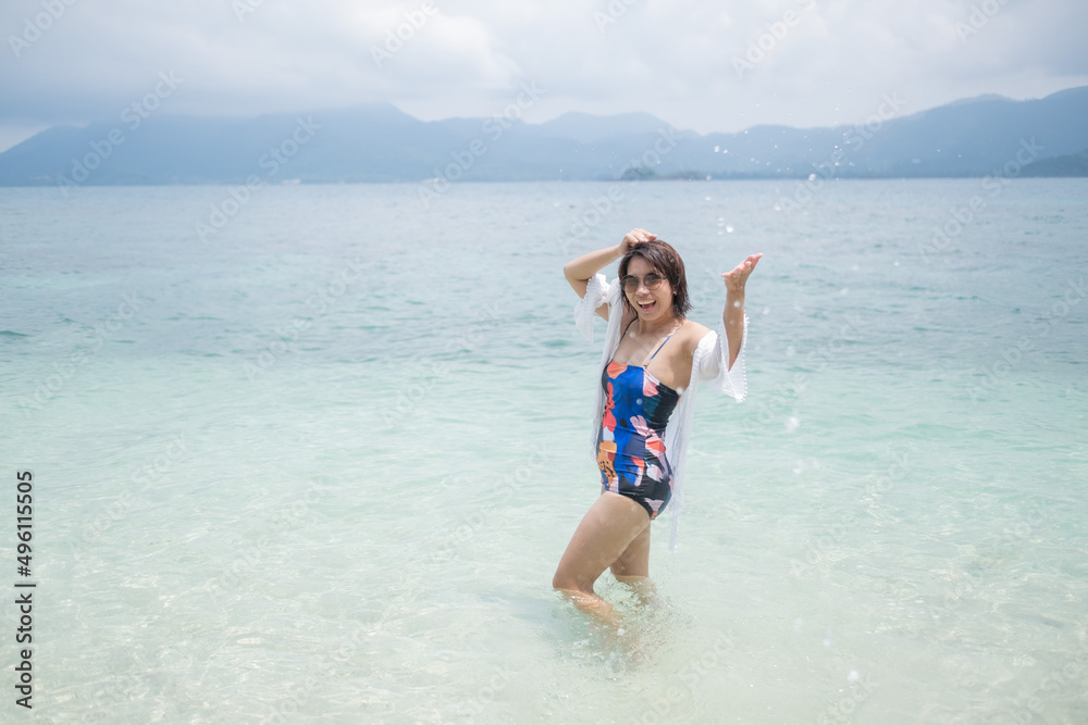 Portrait bikini girl with sea background, asian woman, beauty concept