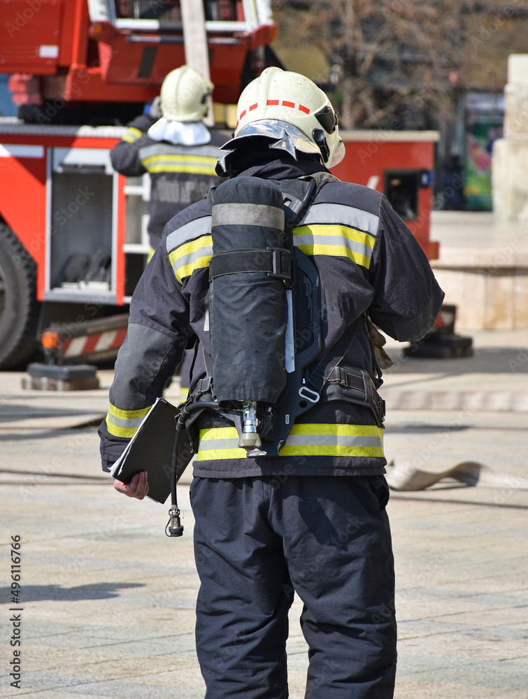 Firefighter at work in the city street Firefighter at work in the city street
