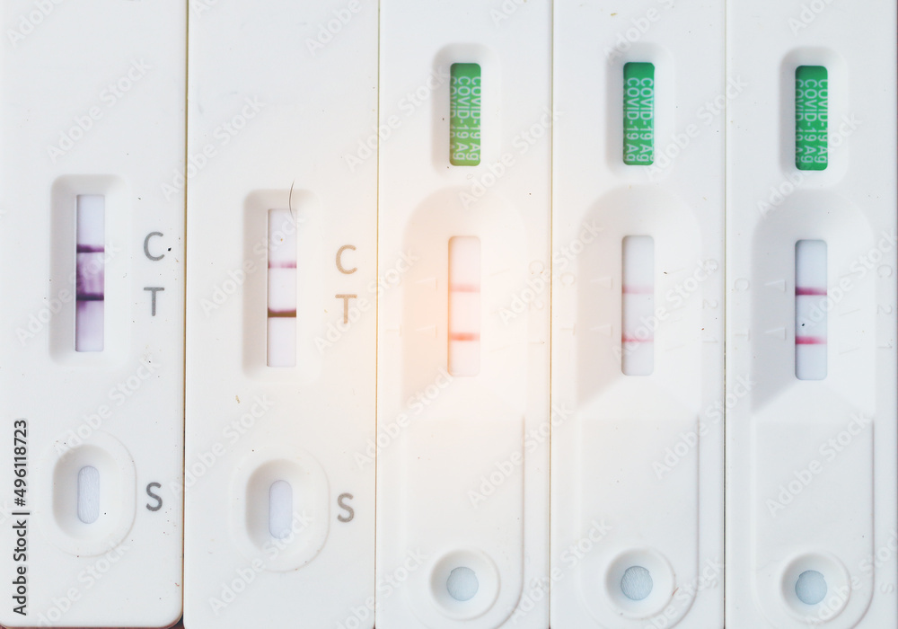 Antigen Test kit with Positive result during swab COVID-19 testing. Coronavirus Self nasal or Home test, Lockdown and Home Isolation concept.