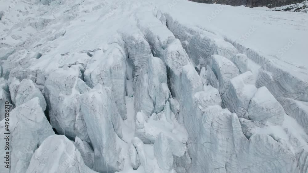 Drone close up view of a large glacier on a sunny day in winter in the Alps Drone close up view of a large glacier on a sunny day in winter in the Alps