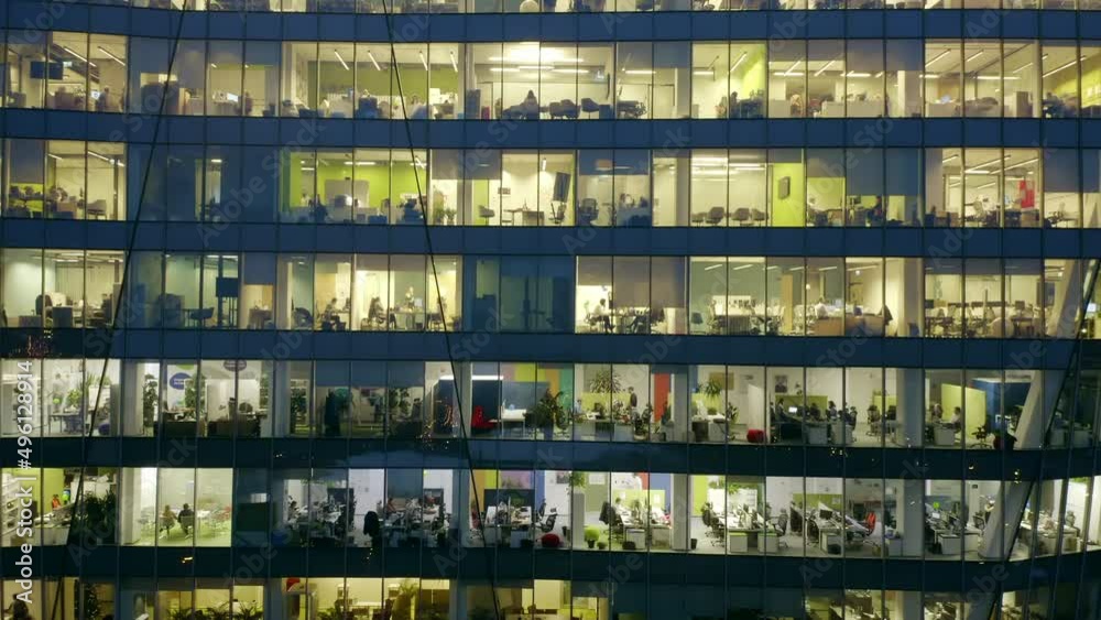 Aerial view of office windows in modern skyscrapers at night. Aerial view of office windows in modern skyscrapers at night.