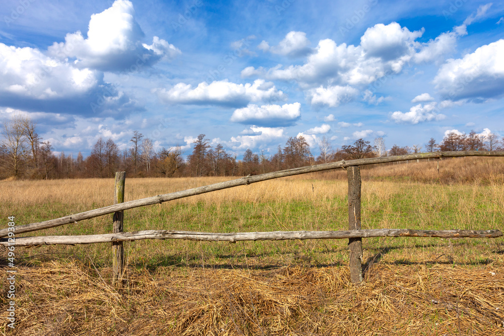 wooden fence on meadow