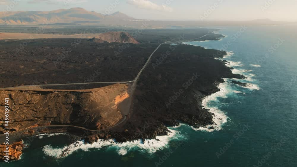 Aerial drone point of view volcanic rocky seaside and Atlantic Ocean of Lanzarote touristic Island, Canaries, Spain