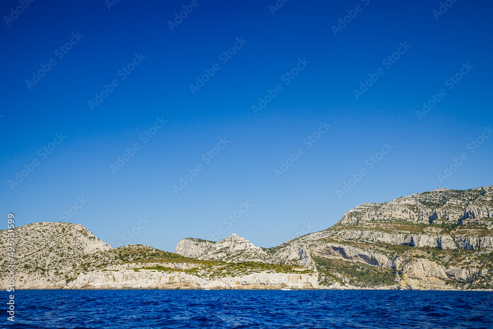 Limestone coast of the Calanques National Park and Mediterranean Sea on a summer day in Provence, France