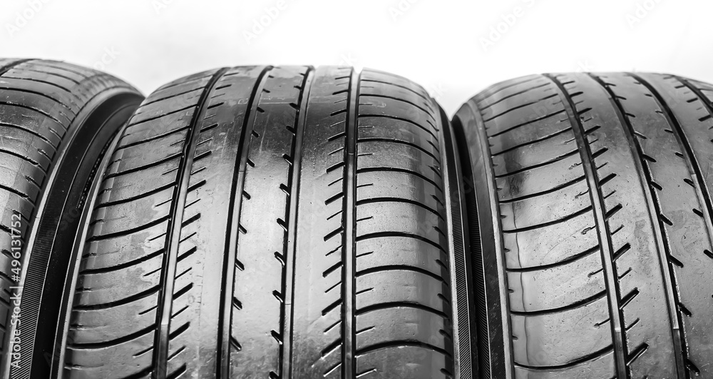 Used Car black summer tires close-up Used Car black summer tires close-up