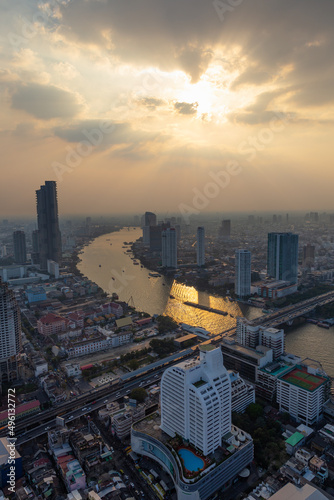 High angle view of the Chao Phraya River in the afternoon Surrounded by skyscrapers in the middle of Bangkok