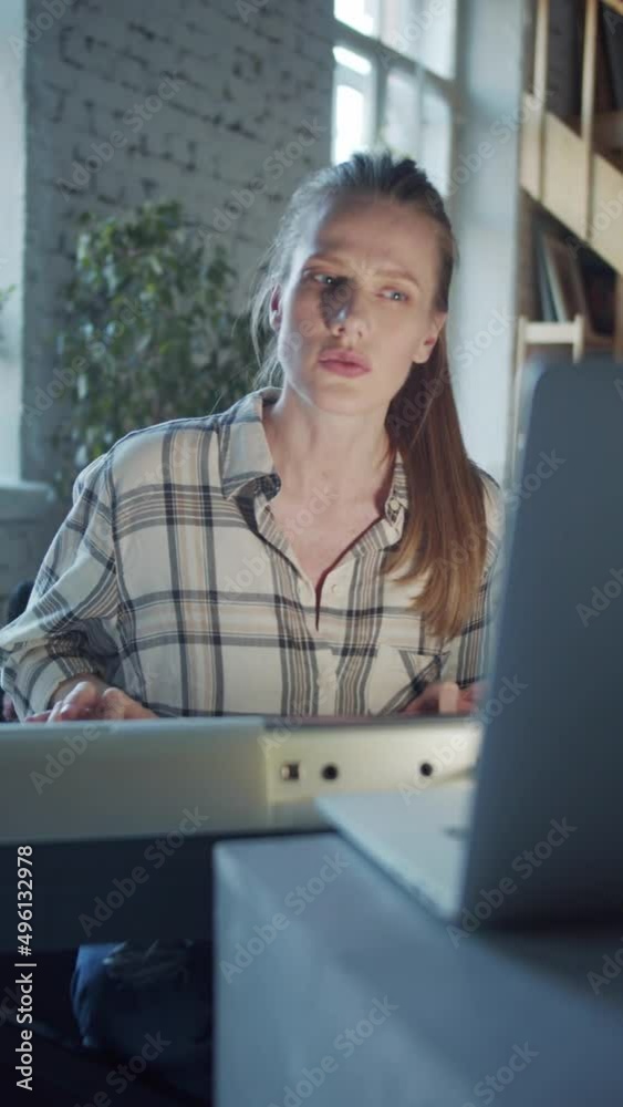 A woman sits in a room in front of a synthesizer and works with a teacher on the Internet A woman sits in a room in front of a synthesizer and works with a teacher on the Internet