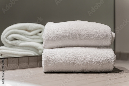 stack of towels in a hotel bathroom