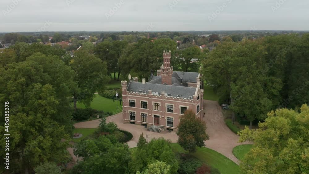 Aerial overview of a beautiful old mansion on a lush, green estate Aerial overview of a beautiful old mansion on a lush, green estate