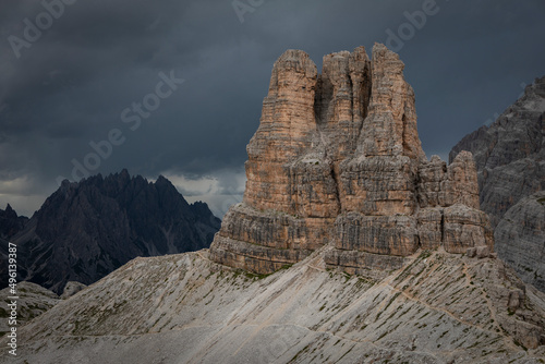 Sasso di Sesto mountains peak in the Dolomite Alps in South Tyrol with dramatic dark sky, Three Peaks Nature Reserve, Italy.
