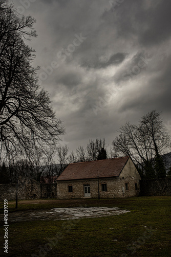 ground floor stone building in solitude, early spring, cloudy skies