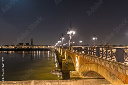 Stone Bridge Empty and Enlightened at Night in Bordeaux With Garonne