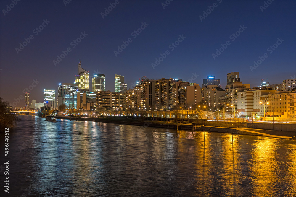 Night Scenery at La Defense Business District With Seine River and Reflections