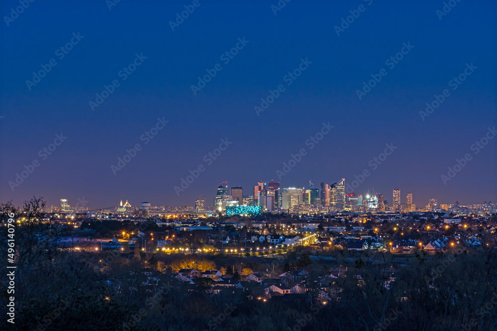 Skyine of La Defense District and Sacred Heart Basilica at Night