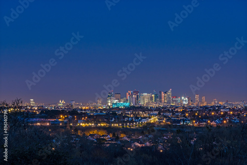 Skyine of La Defense District and Sacred Heart Basilica at Night photo