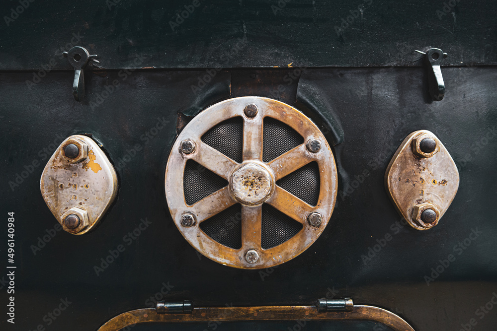 Fototapeta premium Metal parts, nuts, metal rods filled with oil and dust of steam locomotives