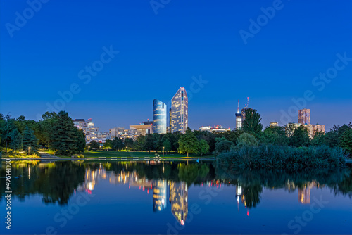 Blue Hour With Enlightened Towers at La Defense District With Reflections on Lake © Loic Timelapse